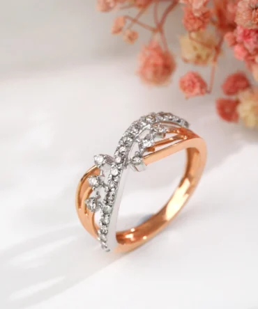 A gold and silver ring with diamonds