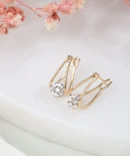 A pair of gold with diamond earrings