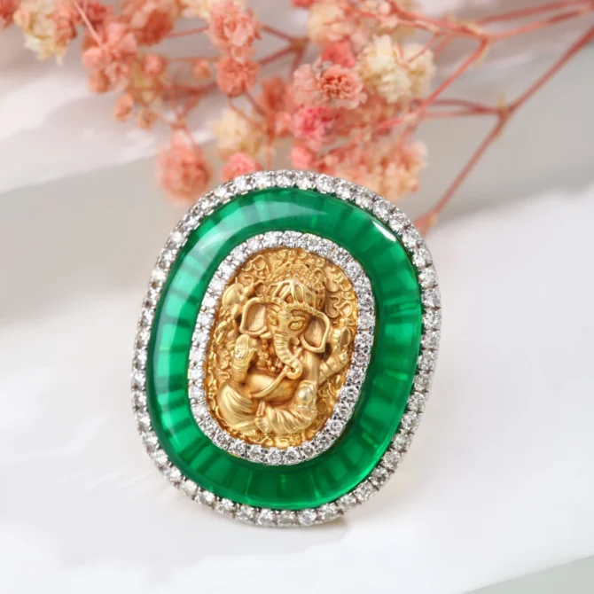 A Ganpati Embedded Green Stone Ring